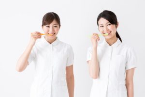 young asian nurse isolated on white background